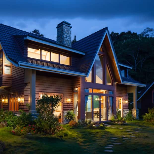 An unedited listing photo of a craftsman home at dusk